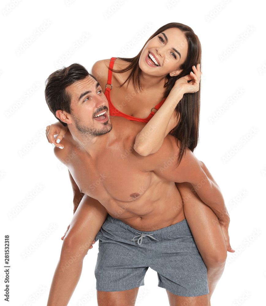 Young attractive couple in beachwear on white background