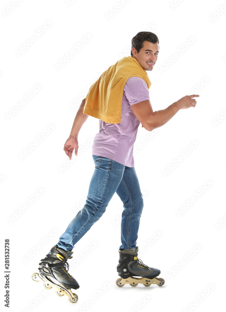 Naklejka premium Handsome young man with inline roller skates on white background