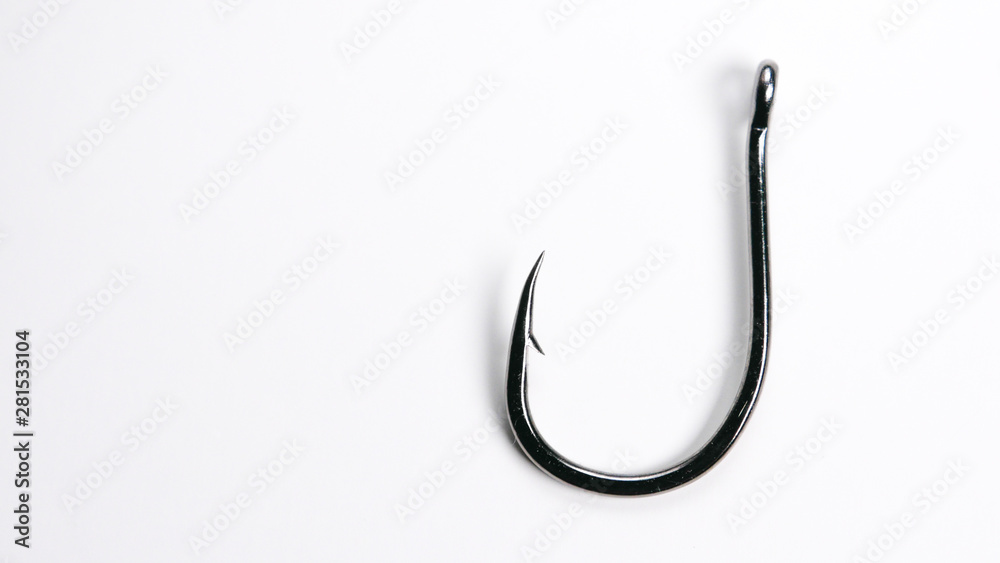 Fishing hook on white background with copy space on left