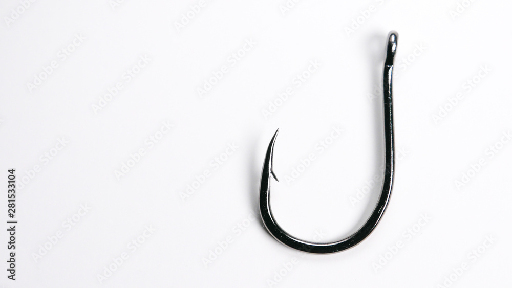 Fishing hook on white background with copy space on left Fishing hook on white background with copy space on left
