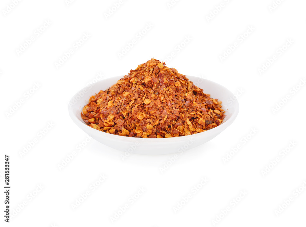 ground chili in white plate on white background ground chili in white plate on white background