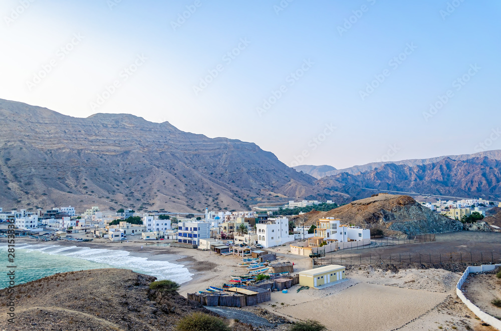 A small fishing village on the beach at the foot of the hills. From Muscat, Oman.