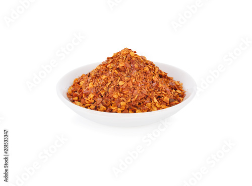 ground chili in white plate on white background