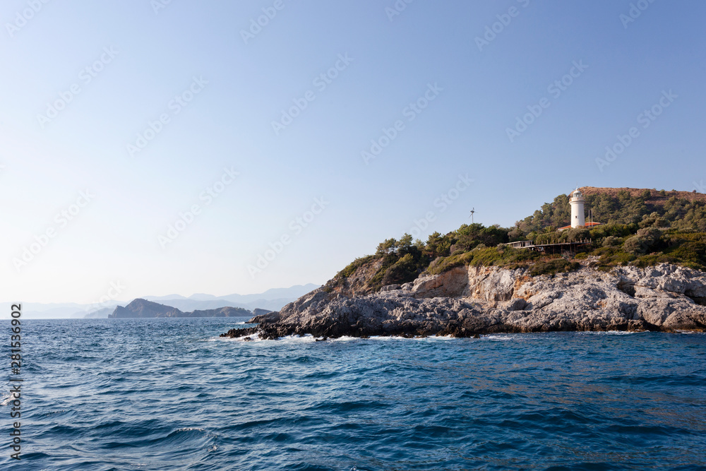 a lighthouse, mountains and seascape in fethiye