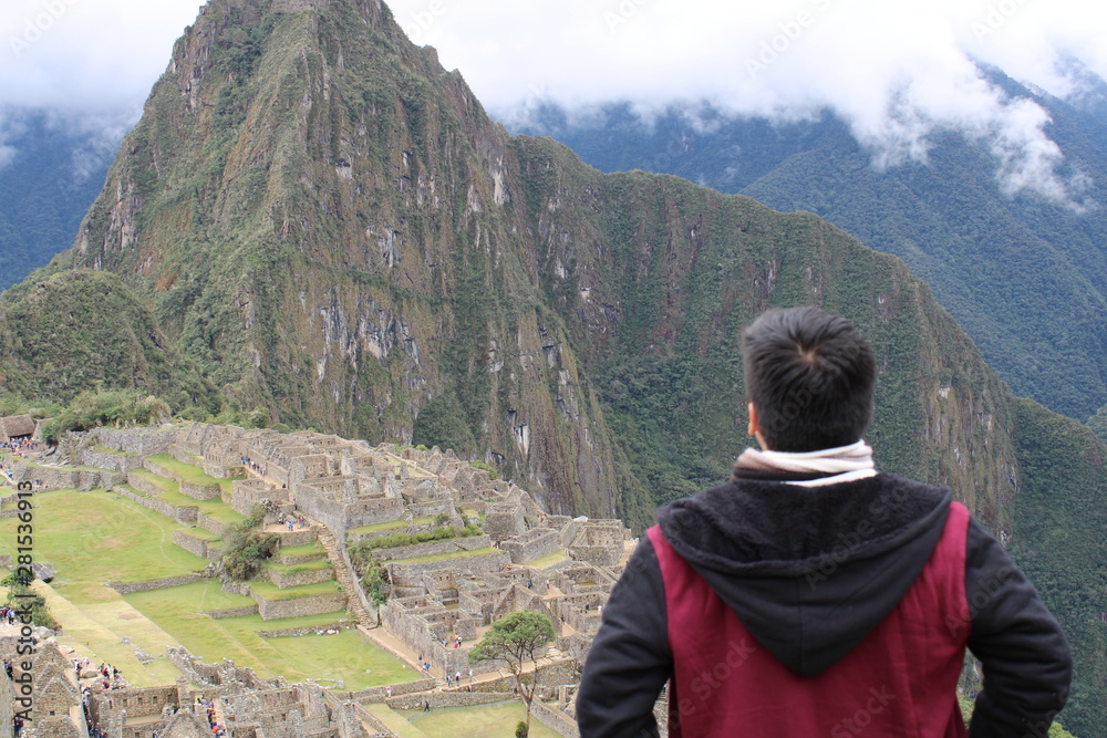 man on top of mountain