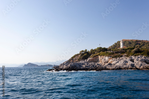 a lighthouse, mountains and seascape in fethiye