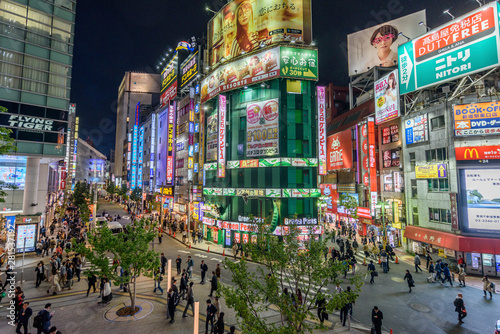 View of illuminated city street at night
