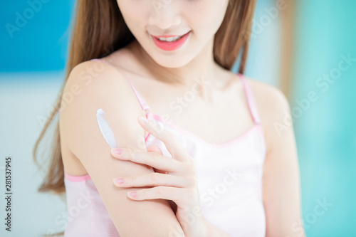 skin care woman applying lotion