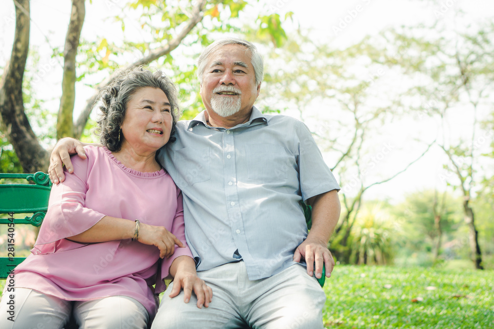 Happy elderly couple with lifestyle after retiree concept. Lovely asian seniors couple embracing together in the park in the morning. Happy elderly couple with lifestyle after retiree concept. Lovely asian seniors couple embracing together in the park in the morning.