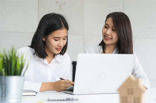 Business Woman teaching trainee employee in the office