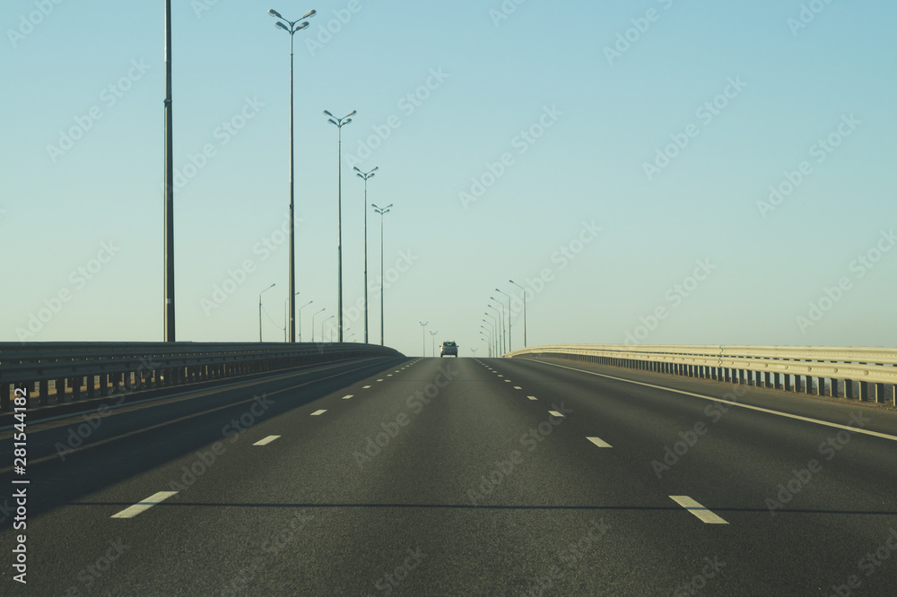 Wide highway. long roadway. road going into the distance