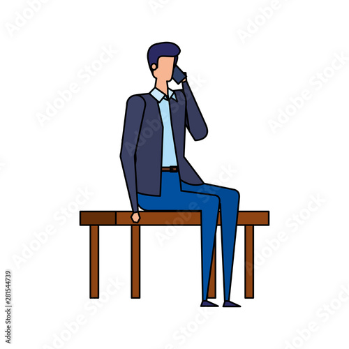 elegant businessman calling with smartphone seated in the park chair