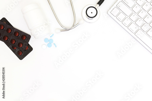Stethoscope, Top view of doctor's desk table, blank paper on white background, above view doctor work tools on white, medical doctor desk concept.
