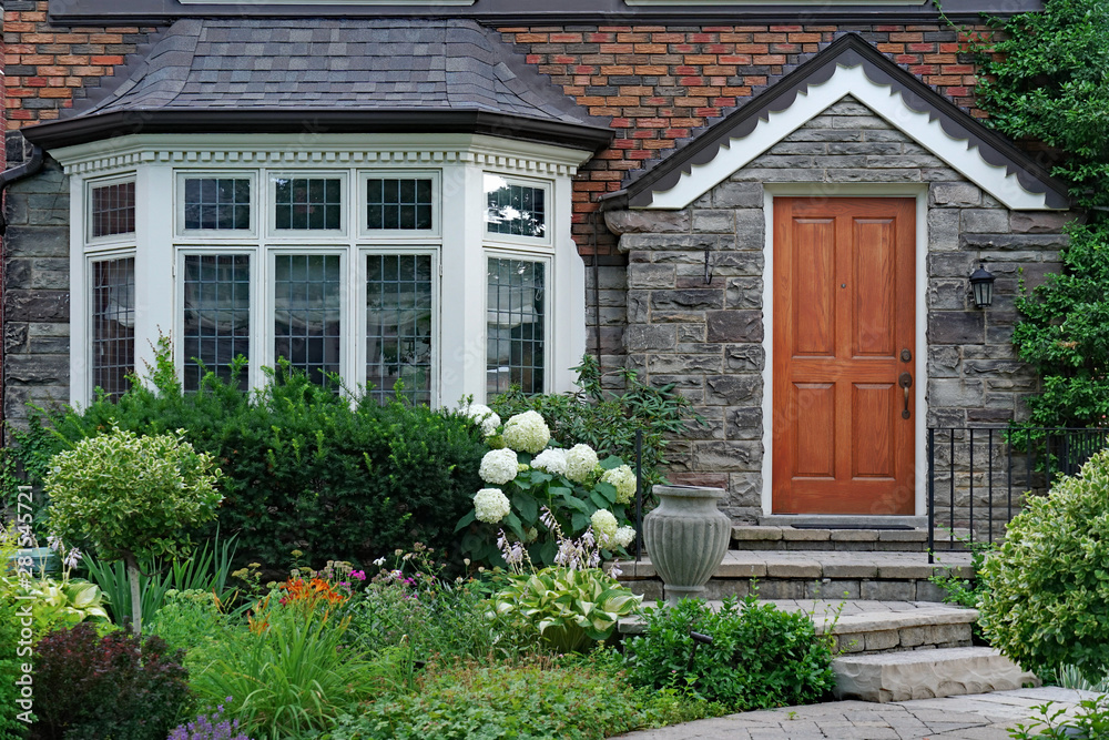 front garden of house with bay window and leaded glass Stock Photo