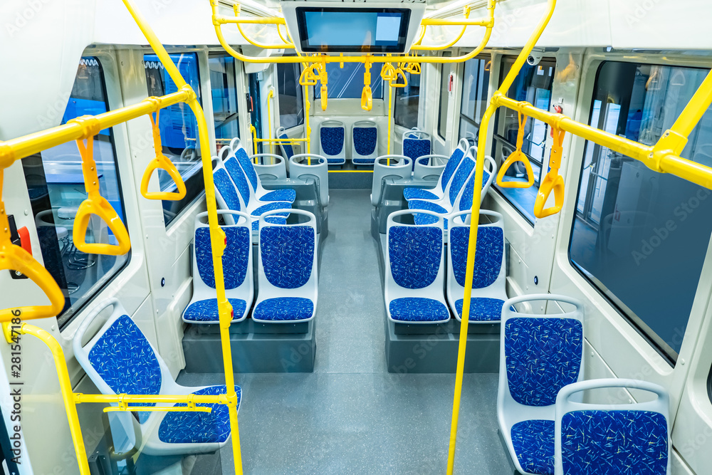 Modern city bas interior. Tour of the city by bus. Passengers seats.  Handrails for holding. Contactless payment transport validators.  Comfortable passenger urban transport. Public land transport. Stock Photo |  Adobe Stock
