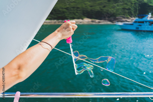 blowing bubbles off a boat