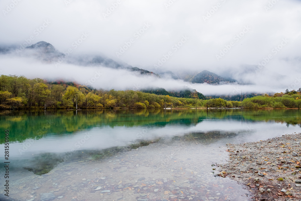Lake  Taisho, Mountain range with misty ,the lake located in Kamikochi national park , the Northern Alps of Japan Alps in Japan.