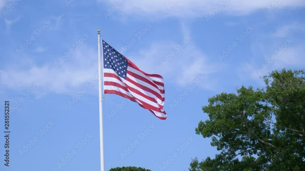 The American flag floating proudly in the air in slow motion The American flag floating proudly in the air in slow motion