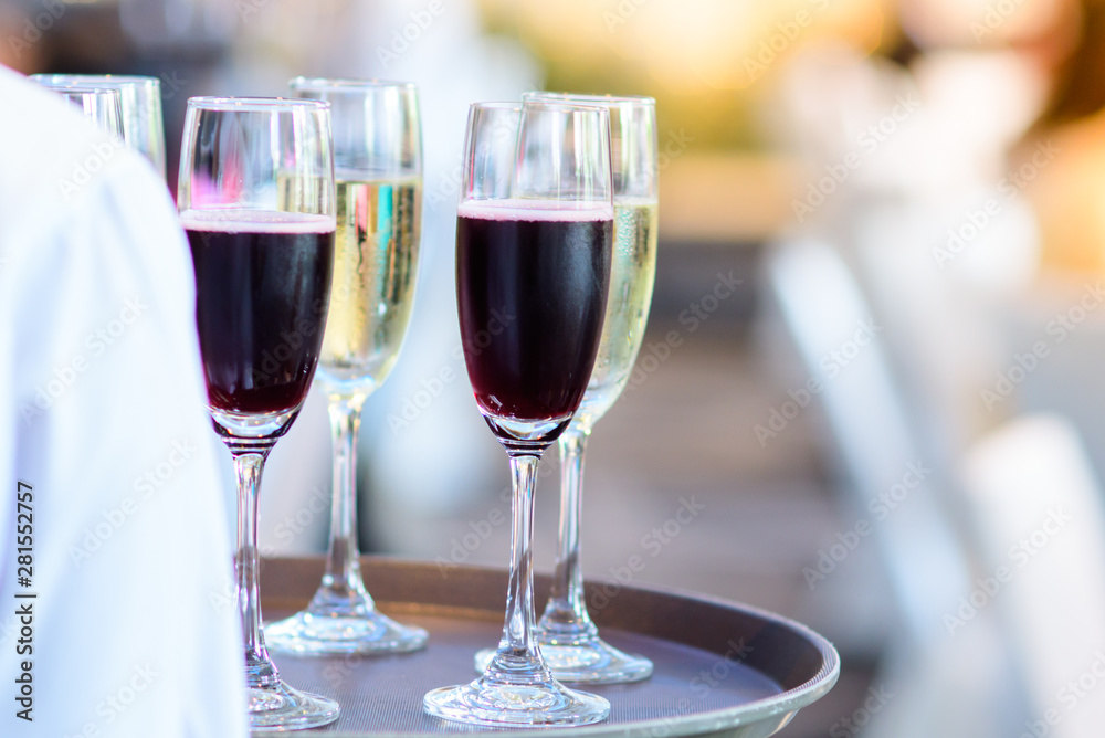 Restaurant staff Holding a glass of wine ready to serve at a party Restaurant staff Holding a glass of wine ready to serve at a party
