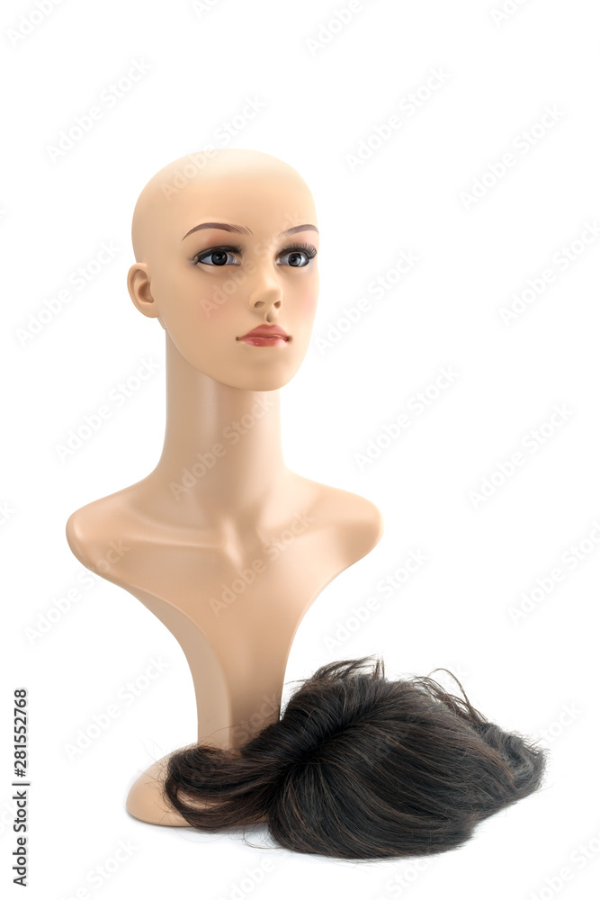 Mannequin woman head fake with dark brown hair wig on white background. Mannequin woman head fake with dark brown hair wig on white background.