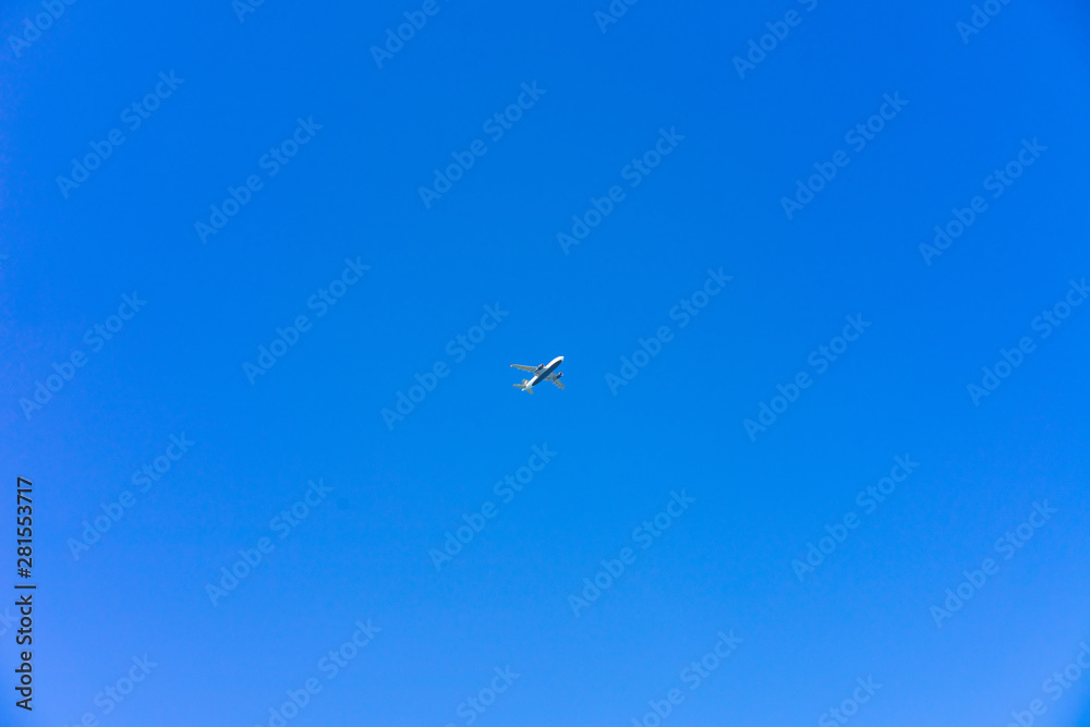 Airplane flying in the sky with no clouds Airplane flying in the sky with no clouds