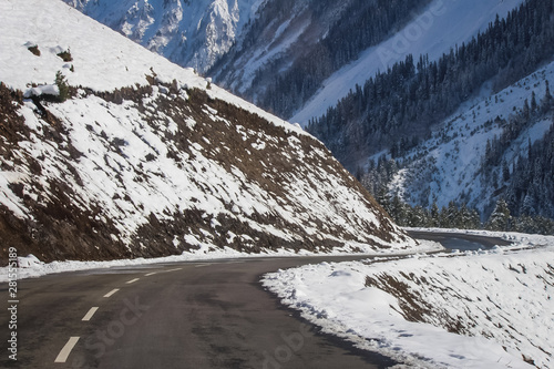 A curvy winding road passing through snow covered mountains of Himalayas at Drass. Srinagar-Leh Highway. BEACON. BRO. NHAI photo