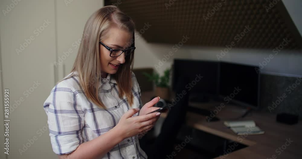Female Executive Using Cellphone At Workplace Female Executive Using Cellphone At Workplace