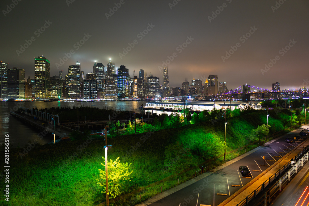 New York, New York/USA - May 12 2018: New York City skyline and Brooklyn Bridge Park