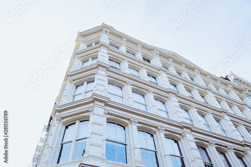 Looking up at a white building in SoHo New York