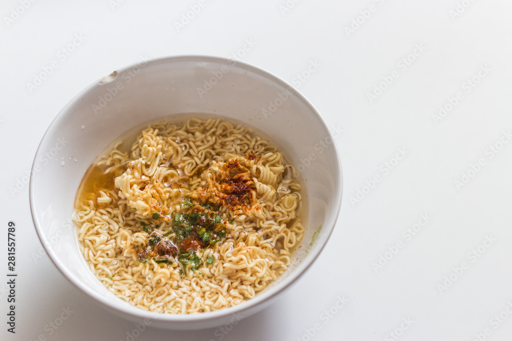 Plate of instant noodles isolated on white background. Top view