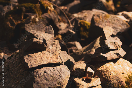 small stone turrets in the forest. stone sculptures