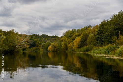 landscape with river and trees in autumn