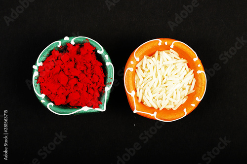 Kumkum And Rice In Pottery Bowl photo