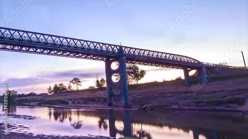 Day to night sunset timelapse of a bridge in Luskintyre with stars and comments photo