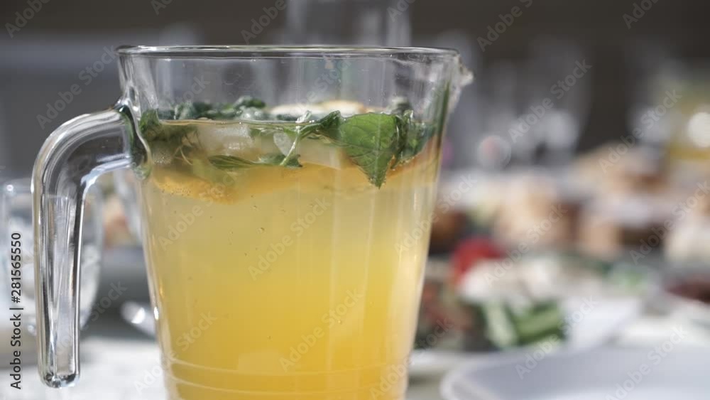 fresh lemonade juice in a clear pitcher with ice mint lemon kiwi fresh lemonade juice in a clear pitcher with ice mint lemon kiwi