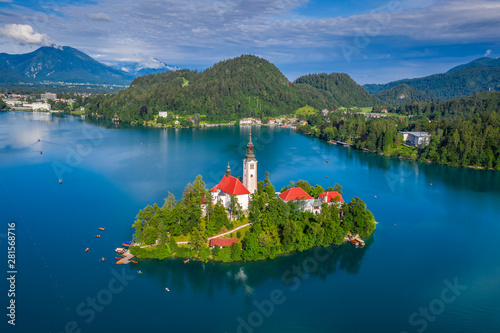 Bled, Slovenia - Aerial view of beautiful Lake Bled (Blejsko Jezero) with the Pilgrimage Church of the Assumption of Maria on a small island and lots of Pletna boats on the lake at summer time
