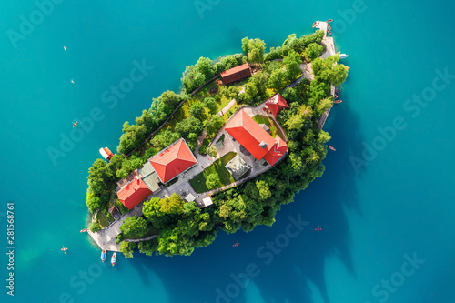 Bled, Slovenia - Aerial view of Lake Bled (Blejsko Jezero) from above the Pilgrimage Church of the Assumption of Maria, turquoise water and traditional Pletna boats on a bright summer day