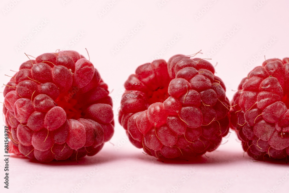 Macro view of red ripe raspberry fruits Macro view of red ripe raspberry fruits
