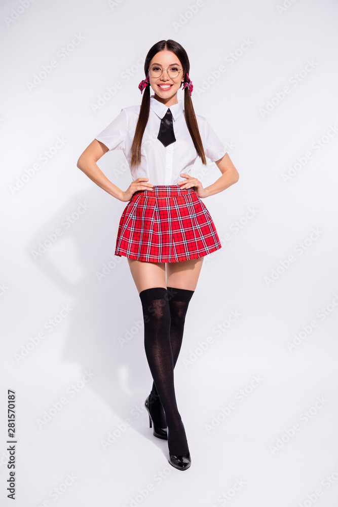 Full length body size view portrait of her she nice-looking attractive lovely charming cute content cheerful cheery girl wearing checkered skirt posing isolated over light white background