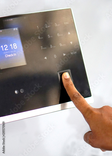 View of man touching the finger print sensor  in automated movement observation or attendance or controlled entry equipment           
