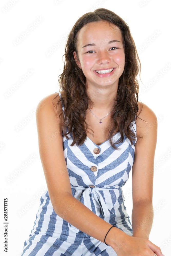 Portrait smiling young girl teen in white blue striped outfit Portrait smiling young girl teen in white blue striped outfit