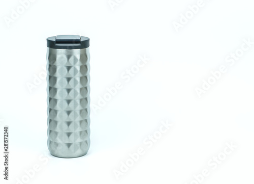 Isolated of eco friendly and zero waste sport thermos stainless steel water bottle in silver color with black caps on white background with copy space on the right