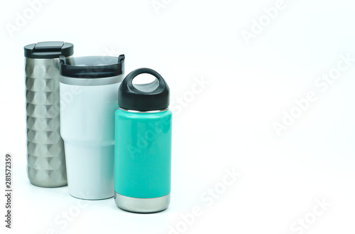 Isolated of three types of eco friendly and zero waste sport thermos stainless steel water bottles in teal white and silver color with black caps on white background with copy space on the right