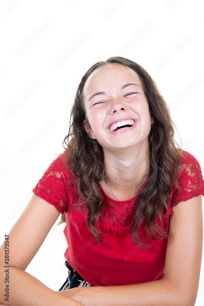 Young cheerful happy girl teen smiling laughing at camera in white background Young cheerful happy girl teen smiling laughing at camera in white background