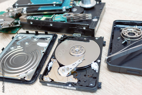 old broken hard disk drives composition in a repair recovery service concept close up selective focus