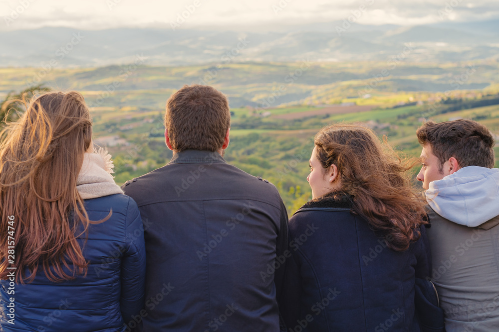 Christian worship and praise. Group of friends hugging outdoors at sunset. Christian worship and praise. Group of friends hugging outdoors at sunset.