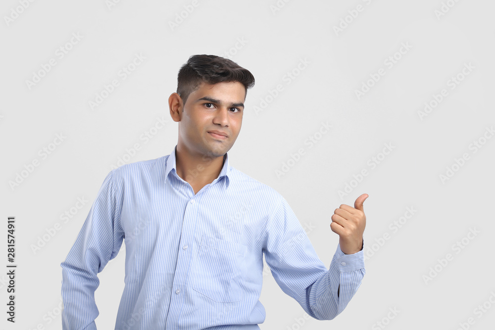 Young Indian Man Showing Direction With Hand Young Indian Man Showing Direction With Hand