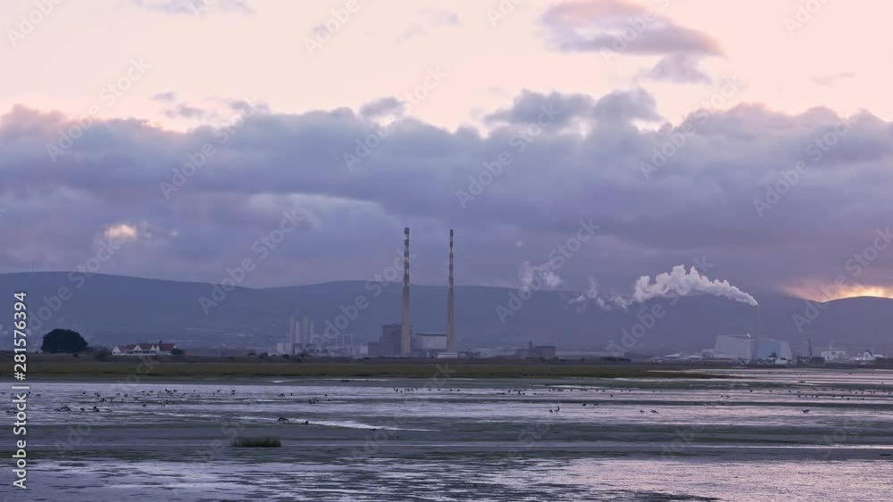 Evening view of Bull Island and Poolbeg skyline in Dublin, Ireland Evening view of Bull Island and Poolbeg skyline in Dublin, Ireland