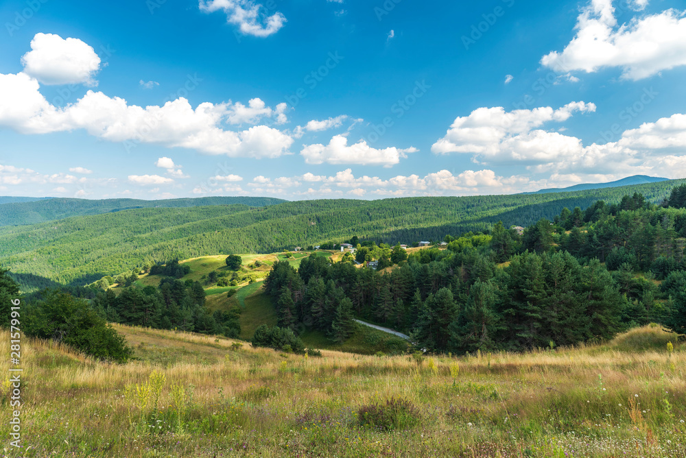Amazing mountain landscape with blue sky with white clouds, natural outdoor travel background. Rhodope mountain, Bulgaria, Churen village