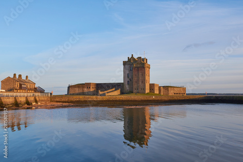 Canvas-taulu Broughty Castle and the Submarine Miners Living Range lit up in the Evening Sun at Broughty Ferry, Dundee in Angus, Scotland